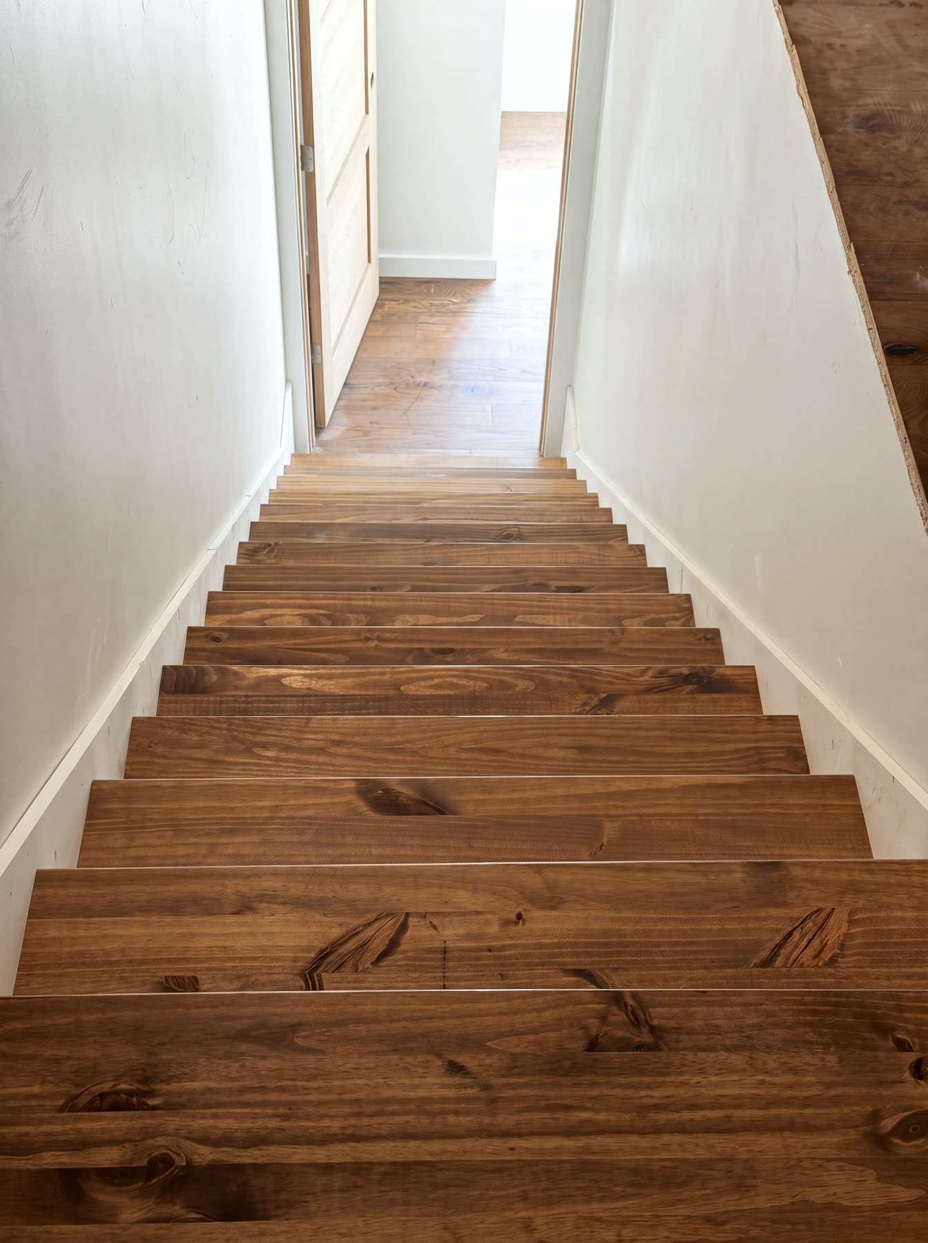 Custom stained wood staircase in a Cumberland Plateau whole-home renovation