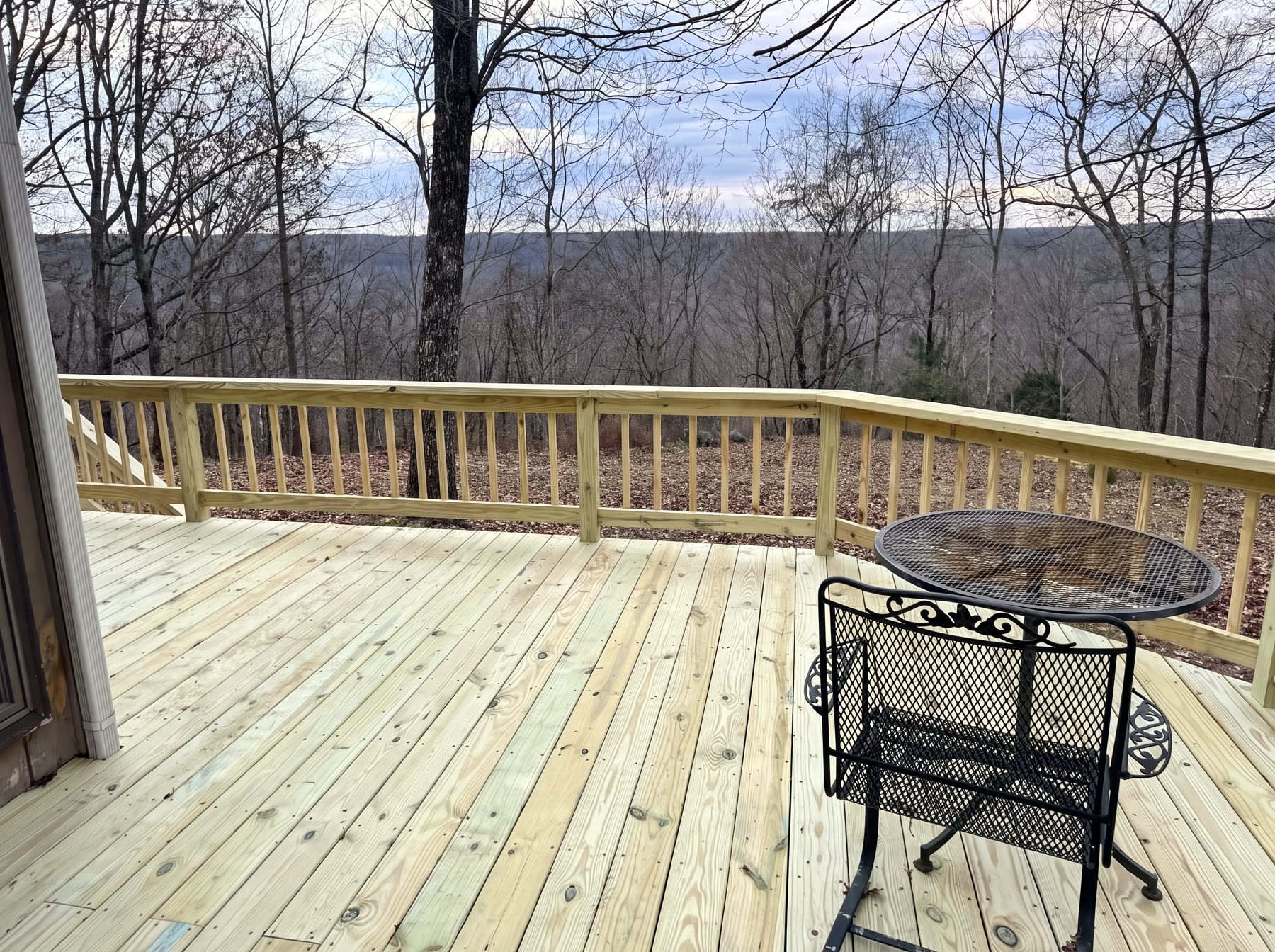 New wraparound wood deck and railing overlooking Cumberland Plateau ridgelines