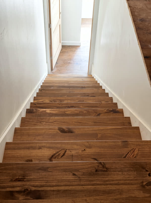 Custom stained wood staircase in a Cumberland Plateau whole-home renovation