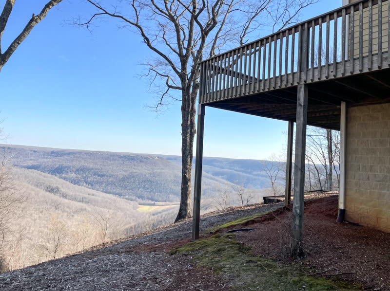 Elevated wood deck cantilevered over a Cumberland Plateau bluff with sweeping valley view
